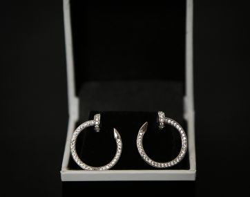 Rhodium plated Silver `nail` style earrings set with Cubic Zirconia.