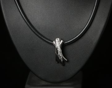 Silver cubic zirconia set pendant on leather thong